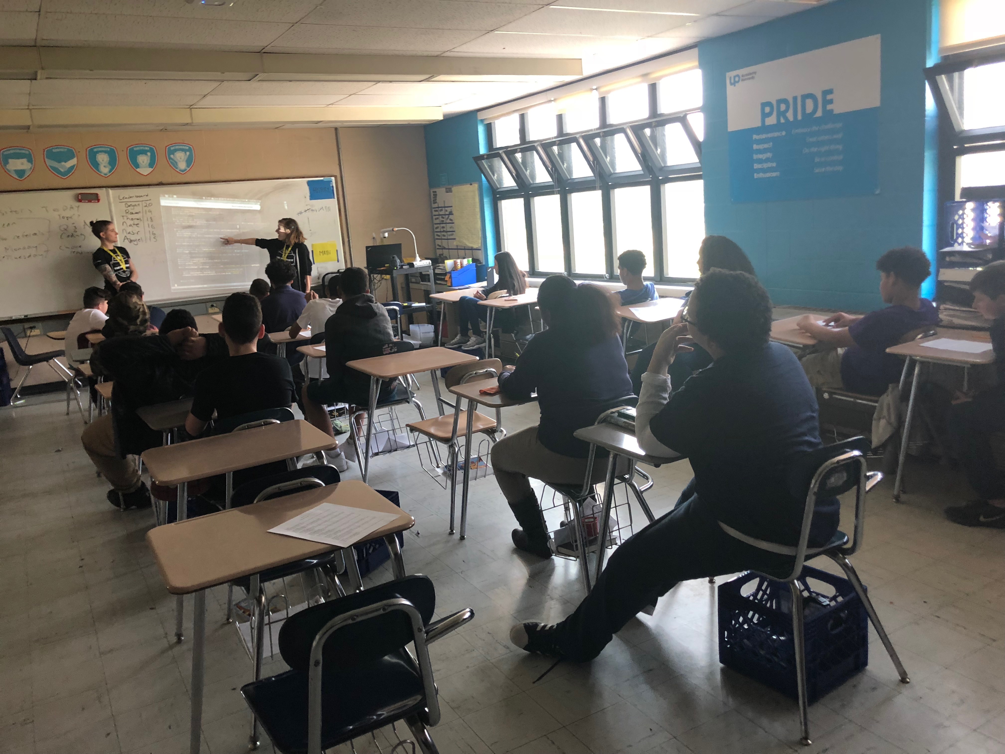 Students looking at a demonstration on the projector