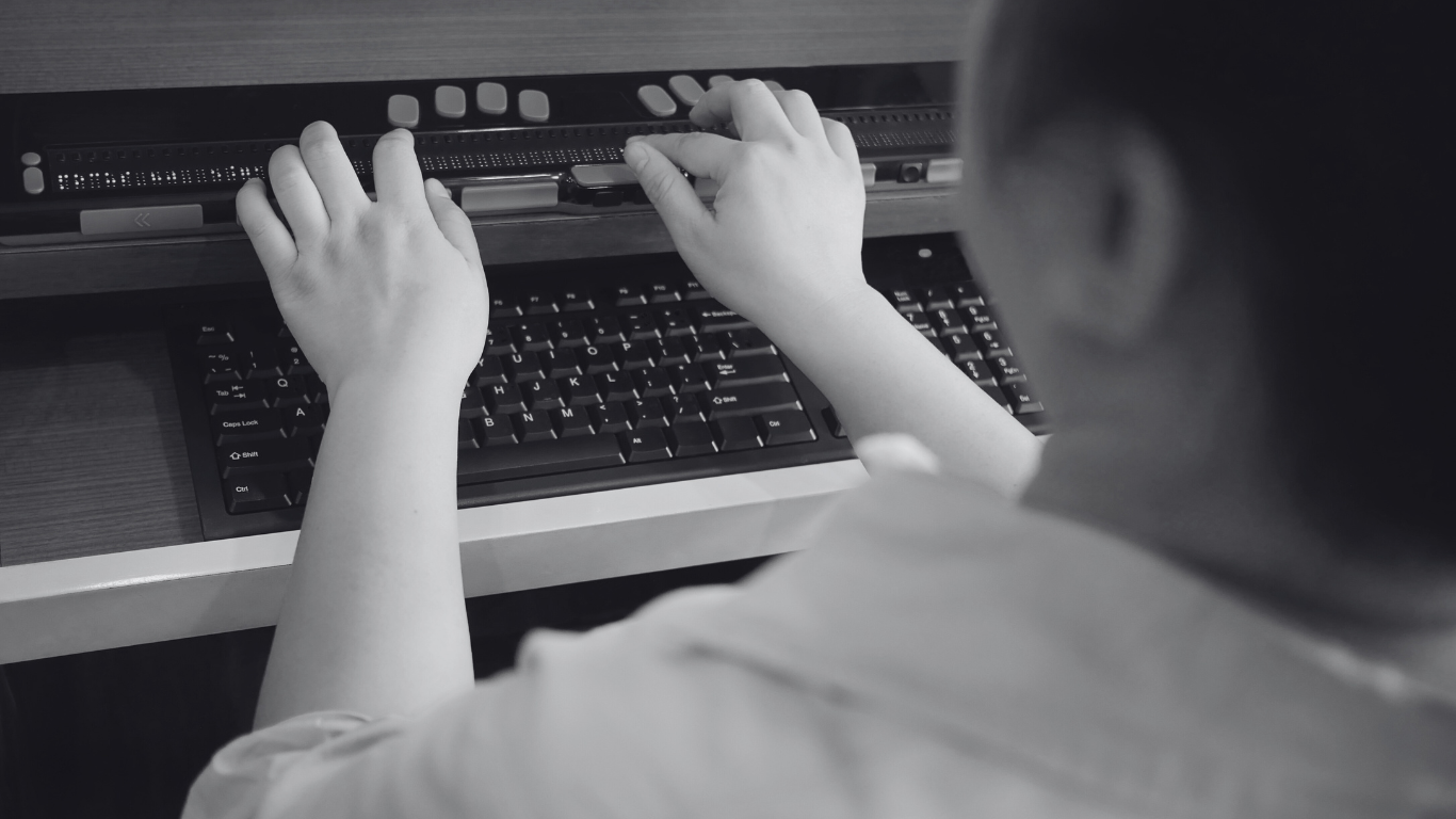 A person using a braille keyboard