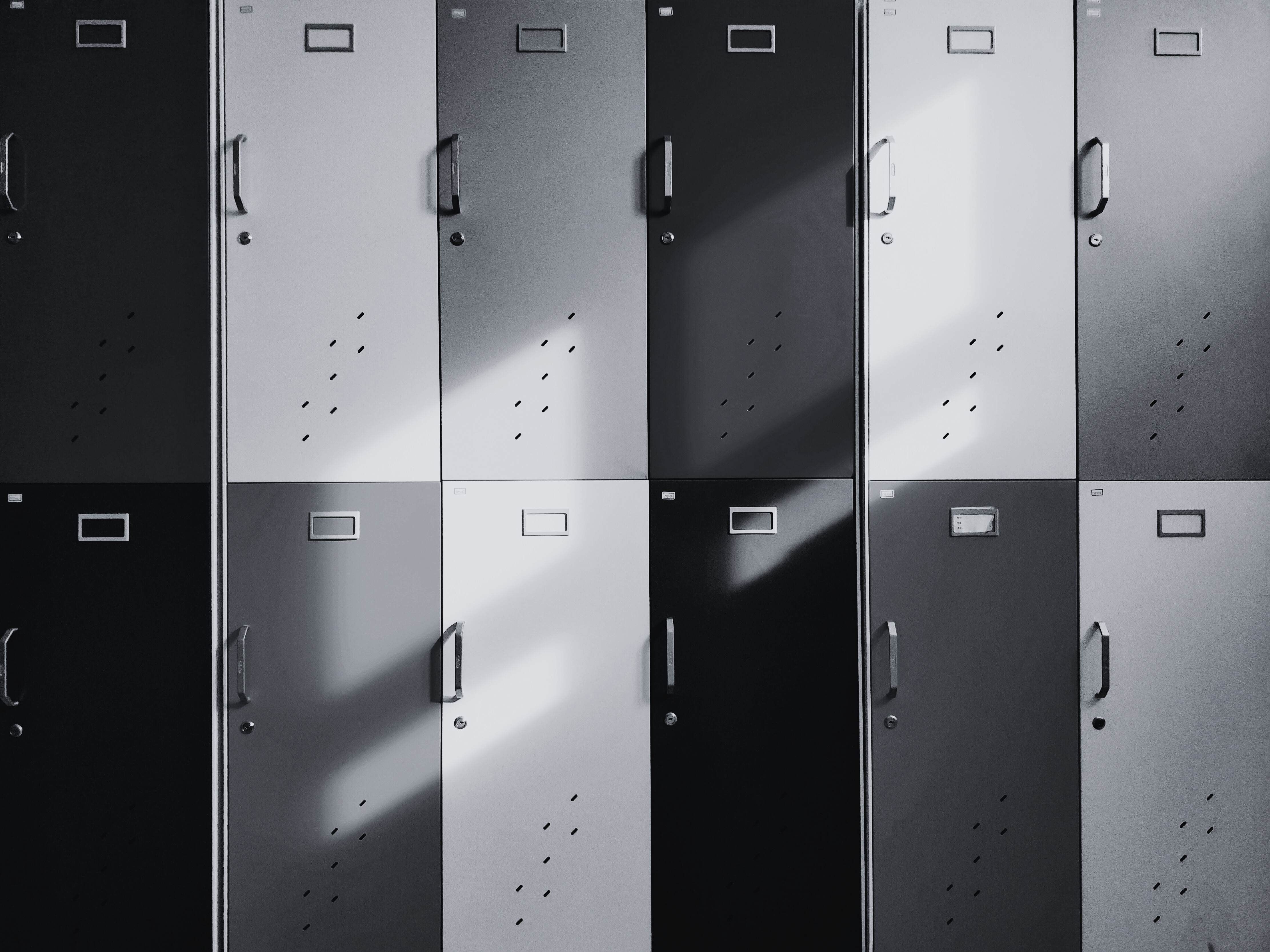 A black and white photo of school lockers. 
