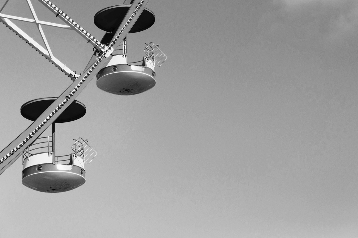 A black and white close up picture of a carousel.