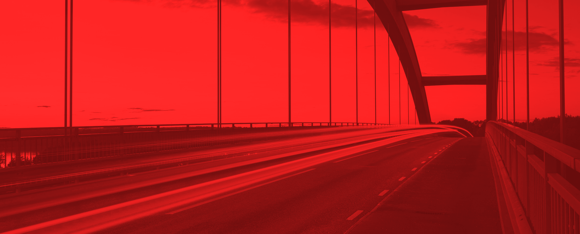 highway bridge with vehicles moving across it with a red mask