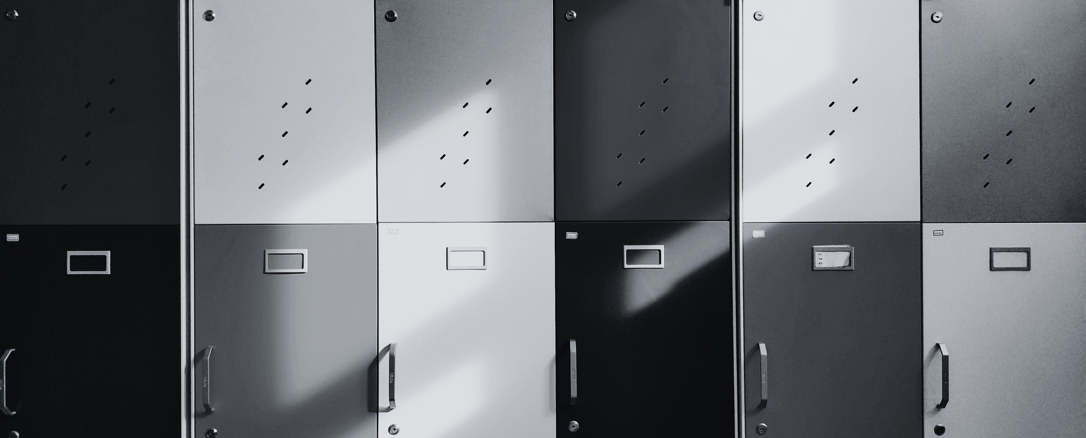 A black and white photo of school lockers. 