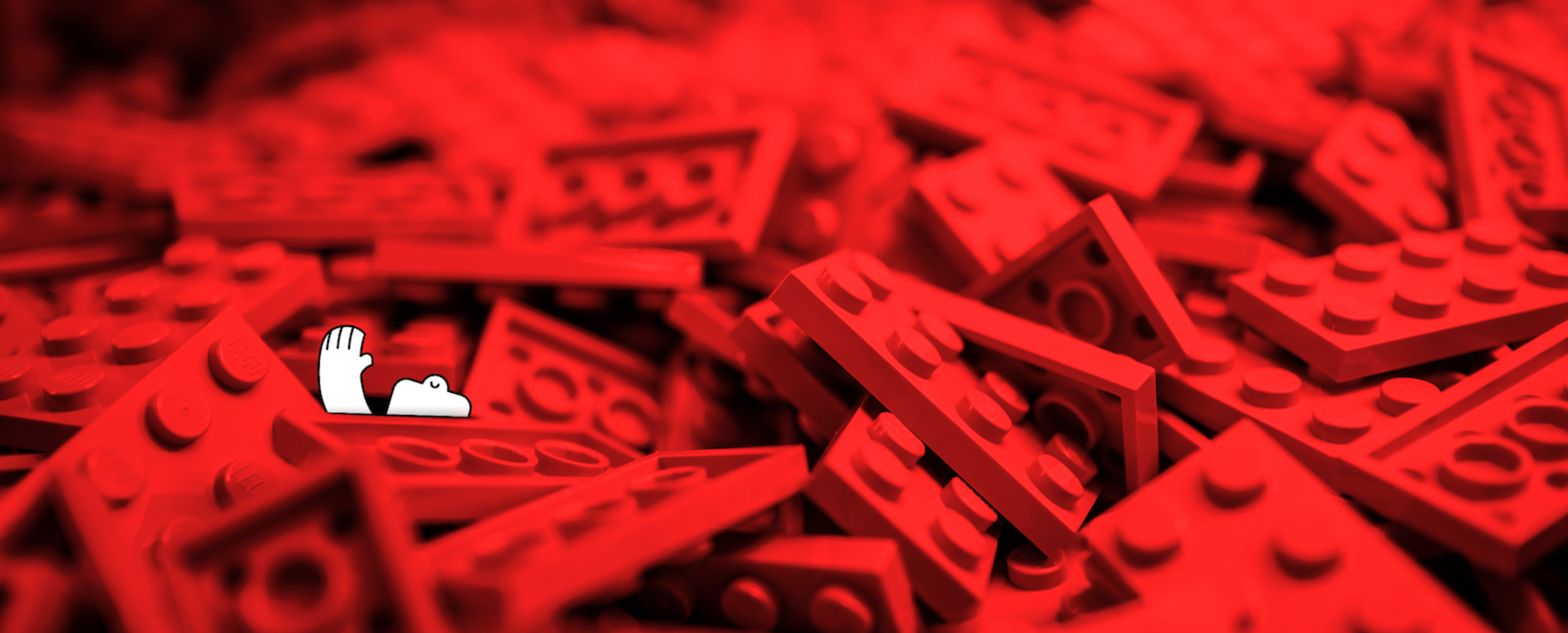 a happy yeti, potentially drowning in a sea of red legos