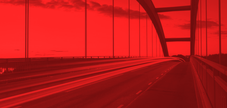 highway bridge with vehicles moving across it with a red mask