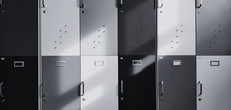 A black and white photo of school lockers. 