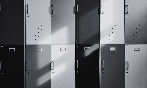 A black and white photo of school lockers. 