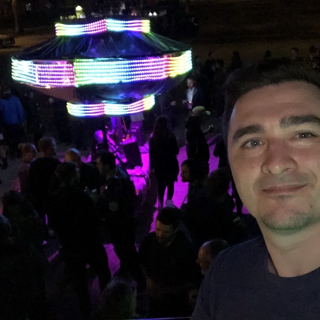 Selfie of Kelly standing in front of Pantheon's UFO at their party 